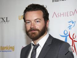 FILE - In this March 24, 2014 file photo, actor Danny Masterson arrives at Youth for Human Rights International Celebrity Benefit in Los Angeles. Masterson, known for his roles in "That '70s Show" and "The Ranch," has been charged with raping three women, Los Angeles County District Attorney's officials announced Wednesday. The incidents occurred between 2001 and 2003, officials allege. Masterson's attorney Tom Mesereau said his client “is innocent, we’re confident that he will be exonerated when all the ev