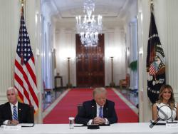 President Donald Trump, Vice President Mike Pence, left, and first lady Melania Trump, attend a "National Dialogue on Safely Reopening America's Schools," event in the East Room of the White House, Tuesday, July 7, 2020, in Washington. (AP Photo/Alex Brandon)