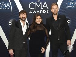 FILE - In this Nov. 14, 2018 file photo, Dave Haywood, from left, Hillary Scott and Charles Kelley, of Lady A, formerly Lady Antebellum, arrive at the 52nd annual CMA Awards in Nashville, Tenn. The Grammy-winning country group, which dropped the word "Antebellum" from their name because of the word's ties to slavery, has filed a lawsuit against a Black singer who has used the stage name for years. The vocal group filed the lawsuit on Wednesday in federal court in Nashville after negotiations with Anita Whit