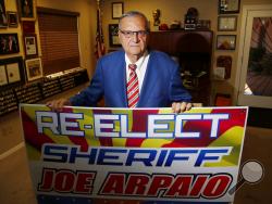 Former Maricopa County Sheriff Joe Arpaio poses for a picture in his office as he is running for the position of Maricopa County Sheriff again, Wednesday, July 22, 2020, in Fountain Hills, Ariz. He faces his former second-in-command, Jerry Sheridan, in the Aug. 4 Republican primary in what has become his second comeback bid. The 88-year-old lawman was unseated in the 2016 sheriff’s race and was trounced in a 2018 U.S. Senate race. (AP Photo/Ross D. Franklin)