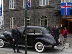 Iceland's president Guðni Th. Jóhannesson waves as he gets into a car following his inauguration in Reykjavik, Iceland Saturday Aug. 1, 2020. In Iceland, a nation so safe that its president runs errands on a bicycle, U.S. Ambassador Jeffery Ross Gunter has left locals aghast with his request to hire armed bodyguards. He's also enraged lawmakers by casually and groundlessly hitching Iceland to President Donald Trump's controversial "China virus” label for the coronavirus. (AP Photo/Árni Torfason)