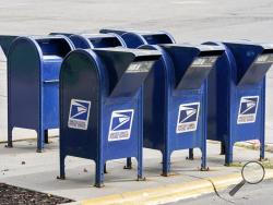 Mailboxes in Omaha, Neb., Tuesday, Aug. 18, 2020. The Postmaster general announced Tuesday he is halting some operational changes to mail delivery that critics warned were causing widespread delays and could disrupt voting in the November election. Postmaster General Louis DeJoy said he would "suspend" his initiatives until after the election "to avoid even the appearance of impact on election mail." (AP Photo/Nati Harnik)