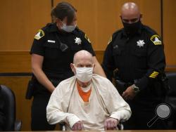 Joseph James DeAngelo, sitting in a wheelchair, is brought out of the courtroom for a break in the schedule for the third day of victim impact statements at the Gordon D. Schaber Sacramento County Courthouse on Thursday, Aug. 20, 2020, in Sacramento, Calif. DeAngelo, 74, a former police officer in California eluded capture for four decades before being identified as the Golden State Killer. DeAngelo pleaded guilty in June to 13 murders and 13 rape-related charges stemming from crimes in the 1970s and 1980s.