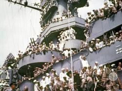 FILE - In this Sept. 2, 1945, file photo, servicemen, reporters, and photographers perch on the USS Missouri for the onboard ceremony in which Japan surrendered, ending World War II. Wednesday, Sept. 2, 2020, is the 75th anniversary of the formal Sept. 2, 1945, surrender of Japan to the United States, when the two sides signed documents officially ending years of bloody fighting in a ceremony aboard the USS Missouri in the Tokyo Bay, with an armada of American warships and planes hovering nearby. (AP Photo,