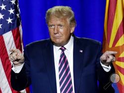 President Donald Trump acknowledges the crowd after participating in a Latinos for Trump Coalition roundtable Monday, Sept. 14, 2020, in Phoenix. (AP Photo/Ross D. Franklin)