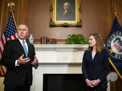 Sen. Thom Tillis, R-N.C., meets with Judge Amy Coney Barrett, President Donald Trump's nominee to the Supreme Court at the U.S. Capitol Wednesday, Sept. 30, 2020, in Washington. (Bill Clark/Pool via AP)