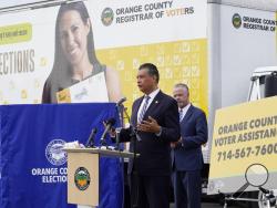 FILE - In this Oct. 5, 2020, file photo, California Secretary of State Alex Padilla, left, and Orange County Registrar of Voters Neal Kelley hold a news conference on Orange County's comprehensive plans to safeguard the election and provide transparency in Santa Ana, Calif. California election officials have received reports that unofficial ballot drop boxes were placed in several counties and said these set-ups are illegal. The Orange County Register reports Monday, Oct. 12, 2020, that Secretary of State s