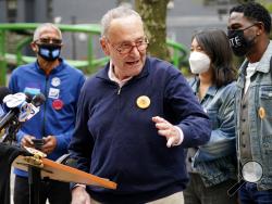 New York Senator Chuck Schumer speaks at a news conference outside an early voting site in New York, Tuesday, Oct. 27, 2020. New Yorkers lined up to vote early for a fourth consecutive day Tuesday after a weekend that saw a crush of more than 400,000 voters statewide. The unofficial tally shows about 194,000 voters this weekend in New York City, where some people waited an hour or more in lines that stretched for several blocks. (AP Photo/Seth Wenig)