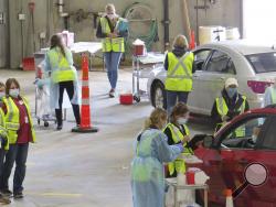 This 2020 photo provided by Carlton County shows their drive-thru flu clinic in Carlton, Minn. The facility is a way to social distance in the coronavirus pandemic, but also served as a test run for the COVID-19 vaccines that county health officials still know little about. (Jared Hovi/Carlton County GIS via AP)