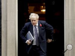 FILE - In this Nov. 10, 2020 file photo British Prime Minister Boris Johnson leaves 10 Downing Street in London. Johnson is self-isolating after being told he came into contact with someone who tested positive for the coronavirus, officials said Sunday Nov. 15. "He will carry on working from Downing Street, including on leading the government's response to the coronavirus pandemic," a statement from his office said. (AP Photo/Matt Dunham, File)
