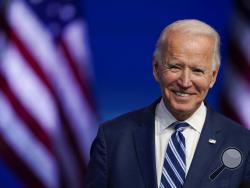 FILE - In this Nov. 10, 2020, file photo President-elect Joe Biden smiles as he speaks at The Queen theater in Wilmington, Del. President-elect Biden turns 78 on Friday, Nov. 20. (AP Photo/Carolyn Kaster, File)