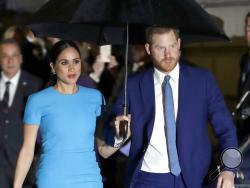 FILE - Prince Harry and Meghan, the Duke and Duchess of Sussex arrive at the annual Endeavour Fund Awards in London on March 5, 2020. The Duchess of Sussex has revealed that she had a miscarriage in July. Meghan described the experience in an opinion piece in the New York Times on Wednesday. She wrote: "I knew, as I clutched my firstborn child, that I was losing my second." The former Meghan Markle and husband Prince Harry have a son, Archie, born in 2019. (AP Photo/Kirsty Wigglesworth, File)