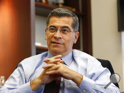 FILE - In this Oct. 10, 2018, file photo, California Attorney General Xavier Becerra discusses various issues during an interview with The Associated Press, in Sacramento, Calif. President-elect Joe Biden has picked Becerra to be his health secretary, putting a defender of the Affordable Care Act in a leading role to oversee his administration’s coronavirus response. (AP Photo/Rich Pedroncelli, File)