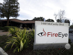 FILE - This Wednesday, Feb. 11, 2015 file photo shows FireEye offices in Milpitas, Calif. Experts say it’s going to take months to kick elite hackers widely believed to be Russian out of U.S. government networks. The hackers have been quietly rifling through those networks for months in Washington’s worst cyberespionage failure on record. FireEye is the cybersecurity company that discovered the worst-ever intrusion into U.S. agencies and was among the victims. It has already tallied dozens of casualties. It