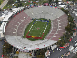 FILE - This Jan. 2, 2017, file pool photo, shows an aerial view of the empty Rose Bowl stadium before to the Rose Bowl NCAA college football game between Southern California and Penn State in Pasadena, Calif. The Rose Bowl was denied a special exemption from the state of California to allow a few hundred fans to attend the College Football Playoff semifinal on Jan. 1, putting the game staying in Pasadena in serious doubt. A person involved with organizing the game told The Associated Press the Tournament of