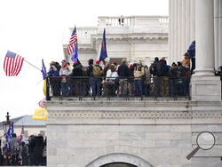 Trump supporters gather outside the Capitol, Wednesday, Jan. 6, 2021, in Washington. As Congress prepares to affirm President-elect Joe Biden's victory, thousands of people have gathered to show their support for President Donald Trump and his claims of election fraud. (AP Photo/Manuel Balce Ceneta)