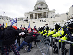 Trump supporters try to break through a police barrier, Wednesday, Jan. 6, 2021, at the Capitol in Washington. (AP Photo/Julio Cortez)