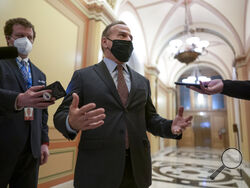 Rep. David Cicilline, D-R.I., talks to reporters just outside the House chamber after a resolution calling for the removal of President Donald Trump from office was blocked by Republicans, at the Capitol in Washington, Monday, Jan. 11, 2021. House Speaker Nancy Pelosi, D-Calif., is calling for congressional action to rein in President Donald Trump after inciting last week's deadly assault on the U.S. Capitol. (AP Photo/J. Scott Applewhite)