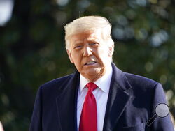 President Donald Trump speaks to the media before boarding Marine One on the South Lawn of the White House, Tuesday, Jan. 12, 2021 in Washington. The President is traveling to Texas. (AP Photo/Gerald Herbert)