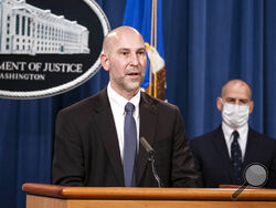 Steven D'Antuono, head of the Federal Bureau of Investigation (FBI) Washington field office, speaks as acting U.S. Attorney Michael Sherwin, right, listens during a news conference Tuesday, Jan. 12, 2021, in Washington. Federal prosecutors are looking at bringing “significant” cases involving possible sedition and conspiracy charges in last week’s riot at the U.S. Capitol. (Sarah Silbiger/Pool via AP)