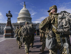 National Guard troops reinforce security around the U.S. Capitol ahead of expected protests leading up to President-elect Joe Biden's inauguration, in Washington, Sunday, Jan. 17, 2021, following the deadly attack on Congress by a mob of supporters of President Donald Trump. (AP Photo/J. Scott Applewhite)