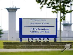 FILE - This Aug. 28, 2020, file photo shows the federal prison complex in Terre Haute, Ind. Two journalists tested positive for coronavirus after witnessing the Trump administration's final three federal executions, but the Bureau of Prisons knowingly withheld the diagnoses from other media witnesses and did not perform any contact tracing. (AP Photo/Michael Conroy, File)