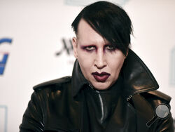 FILE - Marilyn Manson attends the 9th annual "Home for the Holidays" benefit concert on Dec. 10, 2019, in Los Angeles. Manson was dropped by his record label Monday after his ex-fiancé, the actor Evan Rachel Wood, accused him of sexual and other physical abuse. (Photo by Richard Shotwell/Invision/AP, File)