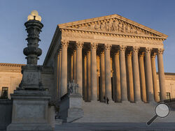 FILE - In this Friday, Nov. 6, 2020 file photo, The Supreme Court is seen at sundown in Washington. The Supreme Court is telling California it can't enforce a ban on indoor church services because of the coronavirus pandemic. The high court issued orders late Friday, Feb. 5, 2021 in two cases where churches had sued over coronavirus-related restrictions in the state. (AP Photo/J. Scott Applewhite, File)