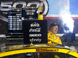 Michael McDowell celebrates after winning the NASCAR Daytona 500 auto race at Daytona International Speedway, Monday, Feb. 15, 2021, in Daytona Beach, Fla. (AP Photo/John Raoux)