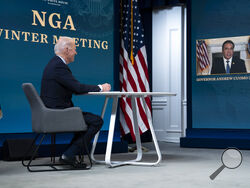 In this Feb. 25, 2021, photo, President Joe Biden listens as Gov. Andrew Cuomo, D-N.Y., speaks during a virtual meeting of the National Governors Association, in the South Court Auditorium on the White House campus in Washington. The Democratic governor is struggling through a sexual harassment scandal that’s testing the limits of his party’s support as Democrats grapple with their first political crisis of the post-Trump era.(AP Photo/Evan Vucci)