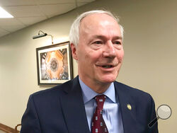 FILE - In this Jan. 13, 2020, file photo, Arkansas Gov. Asa Hutchinson speaks to reporters in Little Rock, Ark. Hutchinson on Tuesday, March 9, 2021, signed into law legislation banning nearly all abortions in the state, a sweeping measure that supporters hope will force the U.S. Supreme Court to revisit its landmark Roe v. Wade decision but opponents vow to block before it takes effect later this year. (AP Photo/Andrew Demillo, File)