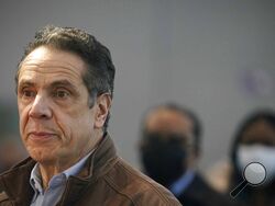 FILE - This Monday, March 8, 2021, file photo shows New York Gov. Andrew Cuomo speaking at a vaccination site in New York. A sixth woman has come forward alleging that Cuomo inappropriately touched her late last year, during an encounter at the governor's mansion. (AP Photo/Seth Wenig, Pool, File)