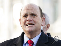 FILE - In this Monday, Dec. 21, 2020, file photo, U.S. Rep. Tom Reed, R-N.Y., speaks to the media on Capitol Hill in Washington. Reed, a Republican from western New York who was accused in March 2021 of rubbing a female lobbyist’s back and unhooking her bra without her consent in 2017, apologized to the woman on Sunday, March 21, 2021, and announced that he will not run for reelection in 2022. (AP Photo/Jacquelyn Martin, File)