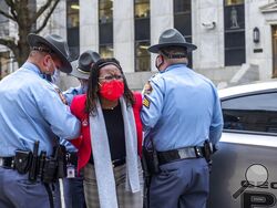 State Rep. Park Cannon, D-Atlanta, is placed into the back of a Georgia State Capitol patrol car after being arrested by Georgia State Troopers at the Georgia State Capitol Building in Atlanta, Thursday, March 25, 2021. Cannon was arrested by Capitol police after she attempted to knock on the door of the Gov. Brian Kemp office during his remarks after he signed into law a sweeping Republican-sponsored overhaul of state elections that includes new restrictions on voting by mail and greater legislative contro