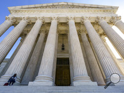 FILE - In this Oct. 7, 2020, file photo the Supreme Court in Washington. After more than a decade in which the Supreme Court moved gradually toward more leniency for minors convicted of murder, the justices have moved the other way. The high court ruled 6-3 Thursday along ideological lines against a Mississippi inmate sentenced to life in prison without the possibility of parole for fatally stabbing his grandfather when the defendant was 15 years old. The case is important because it marks a break with the 