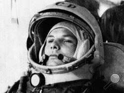 FILE - In this undated file photo, Soviet cosmonaut Major Yuri Gagarin, first man to orbit the earth, is shown in his space suit. Soviet cosmonaut Yuri Gagarin became the first human in space 60 years ago. The successful one-orbit flight on April 12, 1961 made the 27-year-old Gagarin a national hero and cemented Soviet supremacy in space until the United States put a man on the moon more than eight years later. (AP Photo/File)
