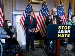 Senate Majority Leader Chuck Schumer of N.Y., accompanied by Sen. Mazie Hirono, D-Hawaii, Sen. Tammy Duckworth, D-Ill., and Sen. Richard Blumenthal, D-Conn., speaks at a news conference after the Senate passed a COVID-19 Hate Crimes Act on Capitol Hill, Thursday, April 22, 2021, in Washington. (AP Photo/Andrew Harnik)