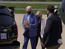 President Joe Biden and first lady Jill Biden walk to a motorcade vehicle after stepping off Marine One at Delaware Air National Guard Base in New Castle, Del., Saturday, April 24, 2021. The Bidens are spending the weekend at their home in Delaware. (AP Photo/Patrick Semansky)