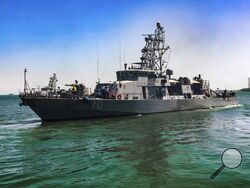FILE - This April 14, 2020, file photo provided by the U.S. Army shows the USS Firebolt in Manama, Bahrain. The Firebolt fired warning shots when vessels of Iran's paramilitary Revolutionary Guard came too close to a recent patrol in the Persian Gulf, the U.S. Navy said Wednesday, April 28, 2021. (Spc. Cody Rich/U.S. Army via AP)