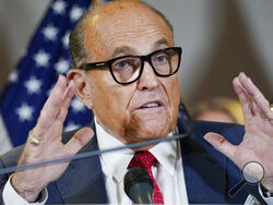 FILE - In this Nov. 19, 2020, file photo, former New York Mayor Rudy Giuliani speaks during a news conference at the Republican National Committee headquarters in Washington. Federal agents raided Giuliani’s Manhattan home and office on Wednesday, April 28, 2021, seizing computers and cellphones in a major escalation of the Justice Department’s investigation into the business dealings of former President Donald Trump’s personal lawyer. (AP Photo/Jacquelyn Martin, File)