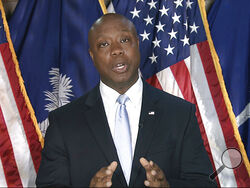 In this image from Senate Television video, Sen. Tim Scott, R-S.C., delivers the Republican response to President Joe Biden's speech to a joint session of Congress on Wednesday, April 28, 2021, in Washington. (Senate Television via AP)