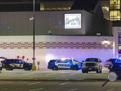 Police line the parking lot outside the Oneida Casino in the early morning hours of Sunday, May 2nd, 2021, near Green Bay, Wisconsin. Authorities in Wisconsin say a gunman killed two people at a Green Bay casino restaurant and seriously wounded a third before he was shot and killed by police Saturday. (AP Photo/Mike Roemer)