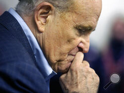 FILE - In this Monday, Oct. 12, 2020, file photo, former New York Mayor Rudy Giuliani pauses while addressing supporters of President Donald Trump during a Columbus Day gathering at a Trump campaign field office in Philadelphia. According to court records unsealed Tuesday, May 4, 2021, federal prosecutors have asked a Manhattan federal judge to appoint a “special master” to oversee the review of materials seized the week before from Giuliani's home. (AP Photo/Jacqueline Larma, File)