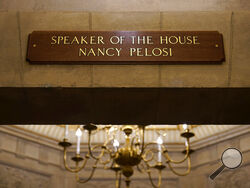 FILE - In this Jan.18, 2021 file photo, a view of the new sign marking the office for House Speaker Nancy Pelosi of Calif., from inside the U.S. Capitol in Washington. The new sign replaces the one that was destroyed when rioters stormed the Capitol. The Justice Department's massive prosecution of those who stormed the U.S. Capitol on Jan. 6 has not been without its problems, including a potential instance of mistaken identity. (AP Photo/Susan Walsh)
