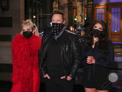 This image released by NBC shows musical guest Miley Cyrus, from left, host Elon Musk, and Cecily Strong during promos in Studio 8H on Thursday, May 6, 2021. (Rosalind O'Connor/NBC via AP)