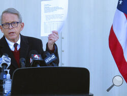 FILE - In this Nov. 18, 2020 file photo, Republican Ohio Gov. Mike DeWine discusses the most recent data on Ohio's soaring coronavirus cases during a news briefing at John Glenn International Airport in Columbus, Ohio. DeWine is ready to address Ohioans in his fourth primetime speech about the state's progress against the coronavirus pandemic. DeWine planned his address for late Wednesday, May 12, 2021. (AP Photo/Andrew Welsh-Huggins)