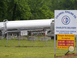 Tanker trucks are parked near the entrance of Colonial Pipeline Company Wednesday, May 12, 2021, in Charlotte, N.C. The operator of the nation’s largest fuel pipeline has confirmed it paid $4.4 million to a gang of hackers who broke into its computer systems. That's according to a report from the Wall Street Journal. Colonial Pipeline’s CEO Joseph Blount told the Journal that he authorized the payment after the ransomware attack because the company didn’t know the extent of the damage. (AP Photo/Chris Carls