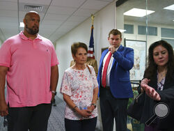 Gladys Sicknick, center, mother of Brian Sicknick, the Capitol Police officer who died from injuries sustained during the Jan. 6 mob attack on Congress, leaves a meeting with Republican Sen. Ron Johnson of Wisconsin after advocating for creation of an independent commission to investigate the assault, at the Capitol in Washington, Thursday, May 27, 2021. She is escorted by Harry Dunn, left, a U.S. Capitol Police officer who faced the rioters on Jan. 6. (AP Photo/J. Scott Applewhite)