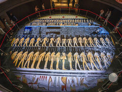 FILE - In this April 24, 2021 file photo, people visit the new National Museum of Egyptian Civilization in Old Cairo, Saturday, April 24, 2021. As some European countries re-open to international tourists, Egypt has already been trying for months to attract them to its archaeological sites and museums. Officials are betting that the new ancient discoveries will set it apart on the mid- and post-pandemic tourism market (AP Photo/Nariman El-Mofty, File)