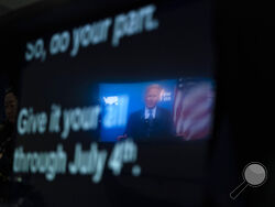 President Joe Biden is reflected in a teleprompter as he speaks about the COVID-19 vaccination program, in the South Court Auditorium on the White House campus, Wednesday, June 2, 2021, in Washington. (AP Photo/Evan Vucci)